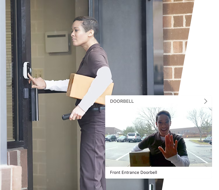 A delivery person interacting with a smart doorbell, integrated with Alarm.com&rsquo;s live video monitoring system, ensuring secure and efficient package delivery.