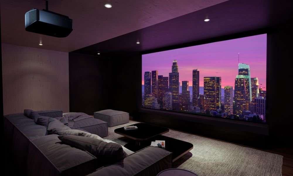 <span class="uk-h4">Stylish home theater with a large projection screen displaying a vibrant cityscape at sunset, featuring a cozy sectional sofa, a modern coffee table, and dim ambient lighting.</span>