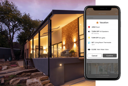 A scenic outdoor view of a home featuring Alarm.com&rsquo;s automated security and lighting controls for safety and convenience.