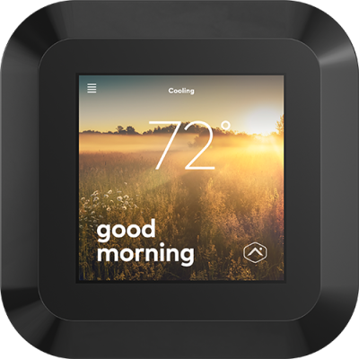 A close-up of an Alarm.com smart thermostat with a sleek display showing the current temperature and greeting &ldquo;Good Morning.&rdquo;