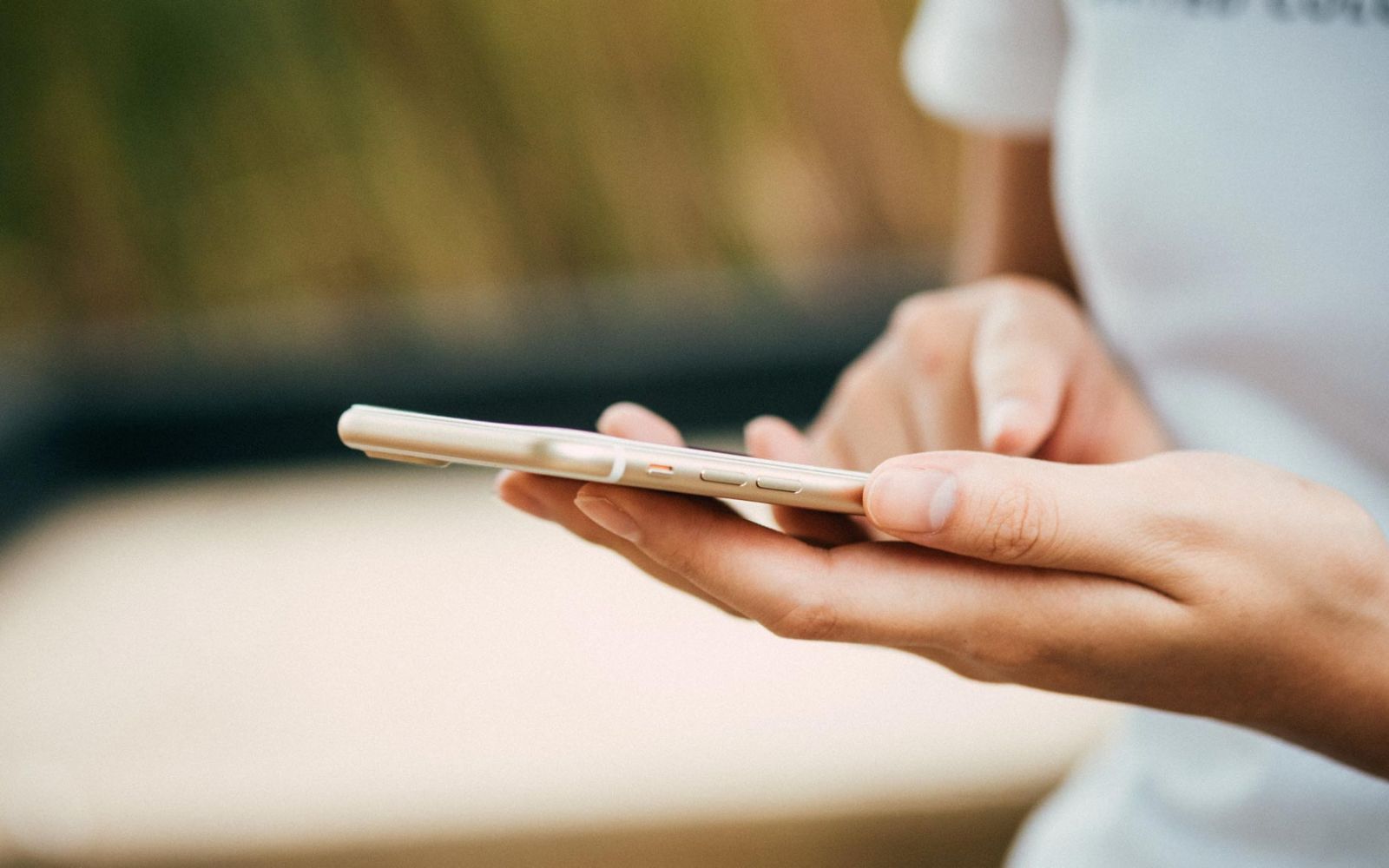 Close-up of person using smartphone outside